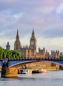 View over the River Thames towards the Palace of Westminster at sunrise, London, England, United Kingdom