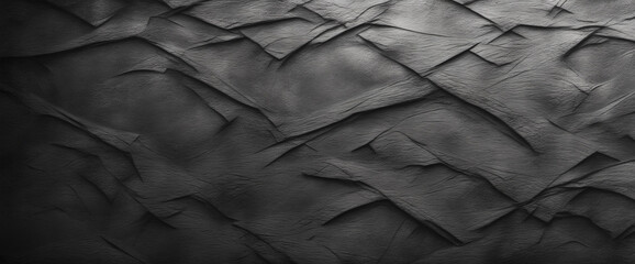 Black grunge background. Rough concrete wall texture in reflection of light closeup. Dark gray grunge banner with copy space for your design.