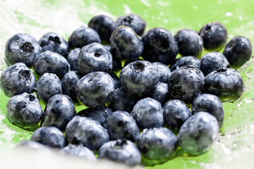 Fresh ripe juicy blue blueberry. Natural and healthy berry concept.Harvest, crop. Blueberry background. Filling the screen with large ripe blueberries. Top view. Vegan sweet food, market