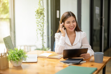 Asian businesswoman working using digital tablet thinking and analyzing work data plan, Verify digital documents