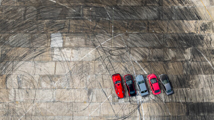 Aerial view super car show on track with tire track skid mark, Top view super car on asphalt road,...