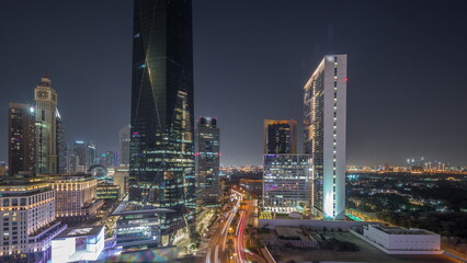 Dubai International Financial district aerial day to night timelapse. Panoramic view of business and financial office towers.