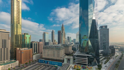 Dubai International Financial district aerial night to day timelapse. Panoramic view of business office towers.