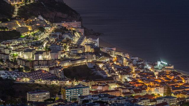 Aerial view of the coastline of the village of Sesimbra day to night timelapse. Portugal © neiezhmakov