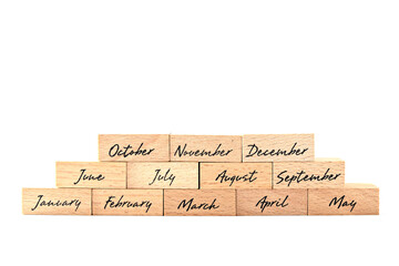 Wooden blocks with months according to calendar year. Bitcoin coin and wooden block. Concept of...