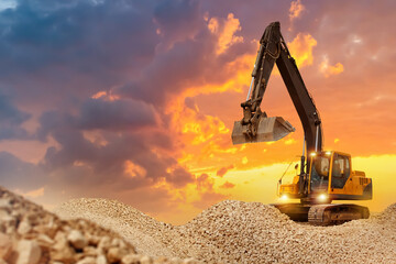 Crawler excavator. Construction equipment at sunset. Excavator is located in stone quarry....