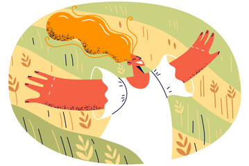 Happy young woman walking in field