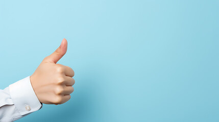 Businessman's hand showing thumbs up on blue background with copy space