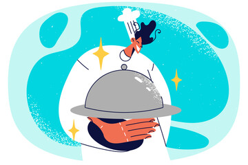 Smiling male chef with food on tray