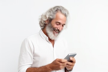 Mature Caucasian man using a smartphone for modern communication, embodying a happy retired lifestyle.