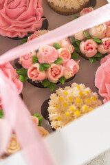 Delicious Gourmet Cupcakes Topped with Buttercream Frosting Flowers