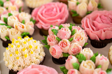 Delicious Gourmet Cupcakes Topped with Buttercream Frosting Flowers
