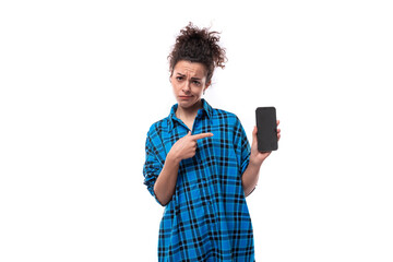 european young lady with curly ponytail hair style showing ads on mobile phone