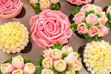 Delicious Gourmet Cupcakes Topped with Buttercream Frosting Flowers