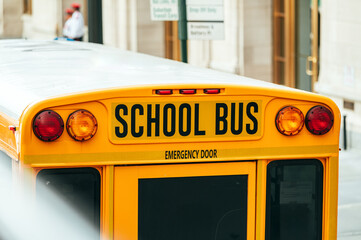 School bus outside brick building in Manhattan