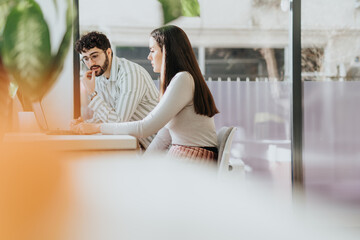Young professionals discuss project details, analyze market opportunities, and plan for business...