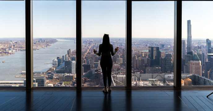 Woman overlooking Manhattan, New York
