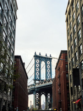 Manhattan Bridge framed between Brooklyn buildings