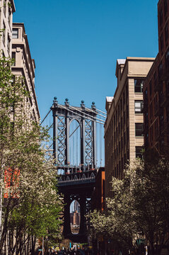 Manhattan Bridge framed between Brooklyn buildings