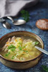 A bowl with chicken soup with pasta	