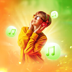 Portrait of young guy, smoothly moving while listening favorite melody against yellow-green...