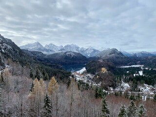 Alpsee with Hohenschwangau Castle and the Bavarian Alps in the background during winter
