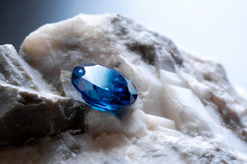 blue sapphire gemstone Round Cut on stone background, close up shot