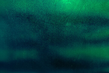 green cosmic backdrop. black dark  green blue brown shiny glitter abstract background with space. Twinkling glow stars effect. Like outer space, night sky, universe. Rusty, rough surface, grain. 