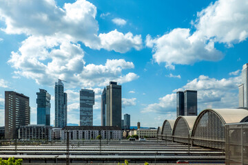 cityscape of Frankfurt seen from a platform at the trainstation - obrazy, fototapety, plakaty