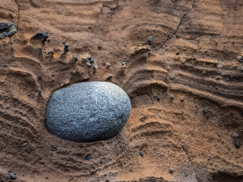 A pyroclastic bomb in the eruption tuff on Isabela Island, Galapagos Islands, UNESCO World Heritage Site, Ecuador