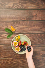 Filling Plate with Fruits and Berries