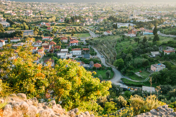 Obraz premium Mosque and panoramic cityscape of town Bar in Montenegro with road and houses, aerial view