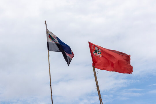 Mozambique rulling and main opposition party flags, flying side by side as a sign of peace