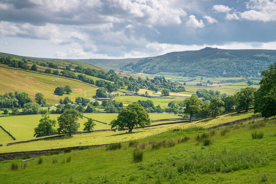 Appletreewick village and the River Wharfe with distant Simon's Seat in Wharfedale, The Yorkshire Dales, Yorkshire, England