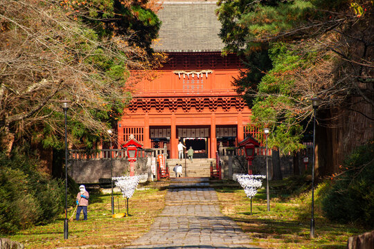 Close up of the fire red main building of The Mount Iwaki Shrine near Hirosaki, North Hon shu, Japan