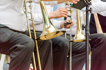 ands and trumpets of symphony orchestra musicians close up