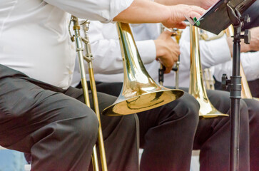 ands and trumpets of symphony orchestra musicians close up