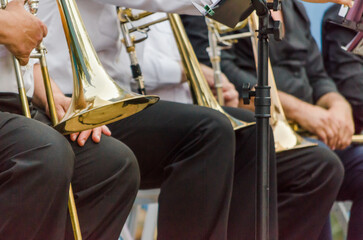 ands and trumpets of symphony orchestra musicians close up