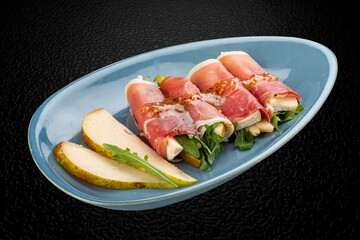 Hamon rolls filled with brie cheese and pear. Isolated image