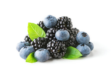 Sweet berries mix with green leaves isolated on white background. Ripe blueberry and blackberry.
