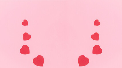 Frame from group of red paper hearts of different sizes, symbols of love. Greeting card. Valentine's day holiday.
