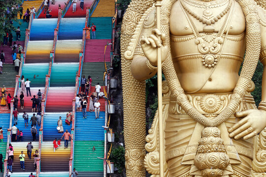 Entrance with the giant statue of Murugan, the Hindu God of War, Hindu Temple and Shrine of Batu Caves, Kuala Lumpur, Malaysia