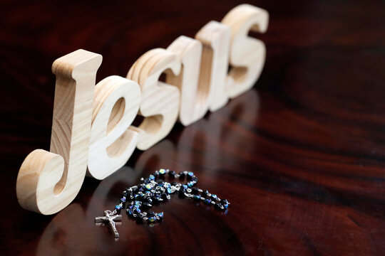 Wooden letters forming the word JESUS and Rosary, Christian symbol, Vietnam, Indochina
