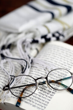 Open Torah, tallit and pair of glasses, France