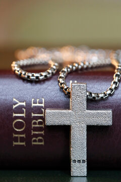Holy Bible book with a Christian cross, symbol of Christianity, Yonne