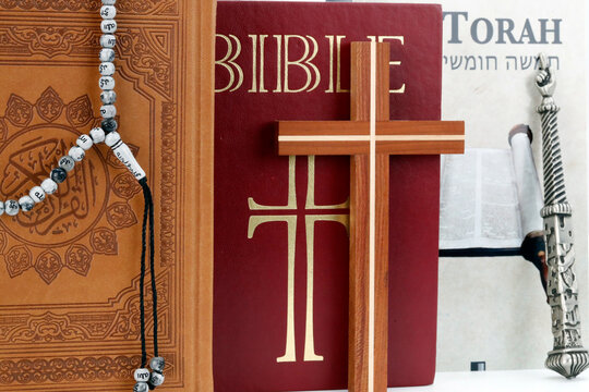 Christianity, Islam and Judaism, Bible, Quran and Torah, interreligious symbols, faith and spirituality concept