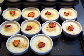 Sweet desserts chocolate mousse with berries in glasses on serving in a hotel for breakfast.