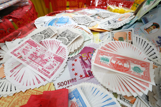 Burning hell bank notes and other forms of joss paper for Buddhist and Taoist ceremony, Phuoc Long Buddhist Temple, Tan Chau, Vietnam, Indochina, Southeast Asia, Asia