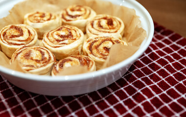 Fresh homemade raw Cinnamon rolls prepared for baking.