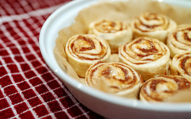Fresh homemade raw Cinnamon rolls prepared for baking.